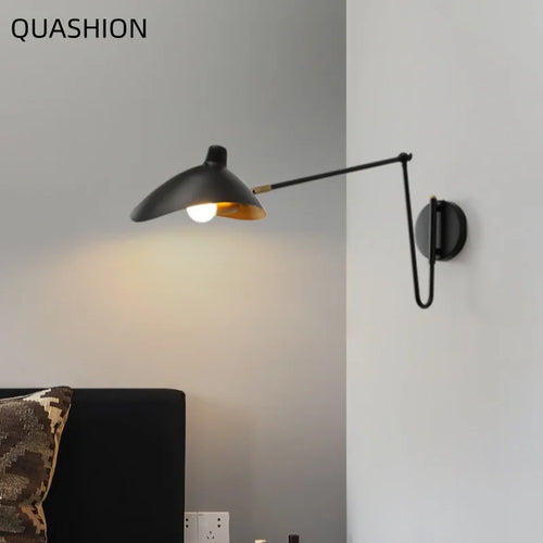 The Arco Swing Arm Wall Sconce